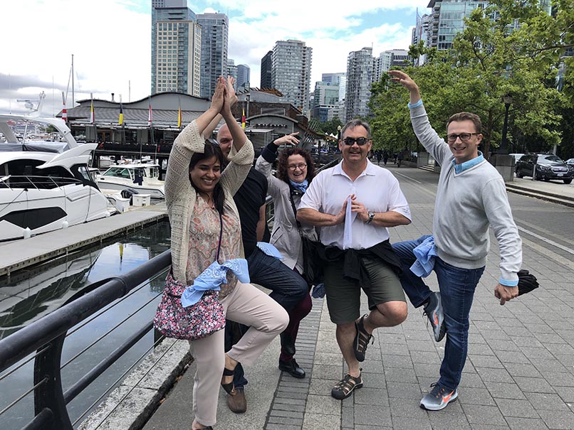 a group of colleagues playing wild goose chase team building activity in the spring months
