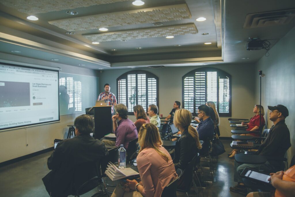 a group of colleagues doing an off site team building activity together on a projector