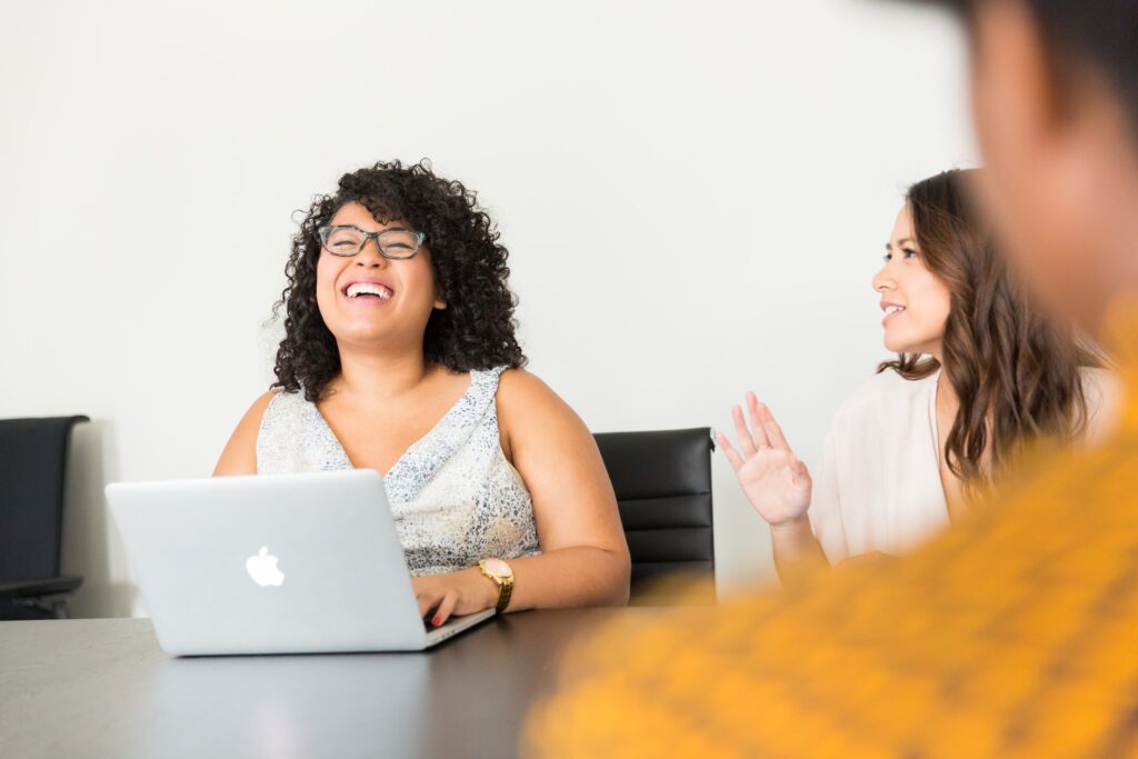 a happy employee enjoying their workday at their desk