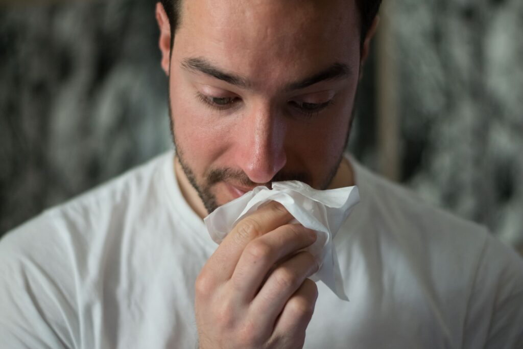 a man feeling unwell and taking a sick day from work