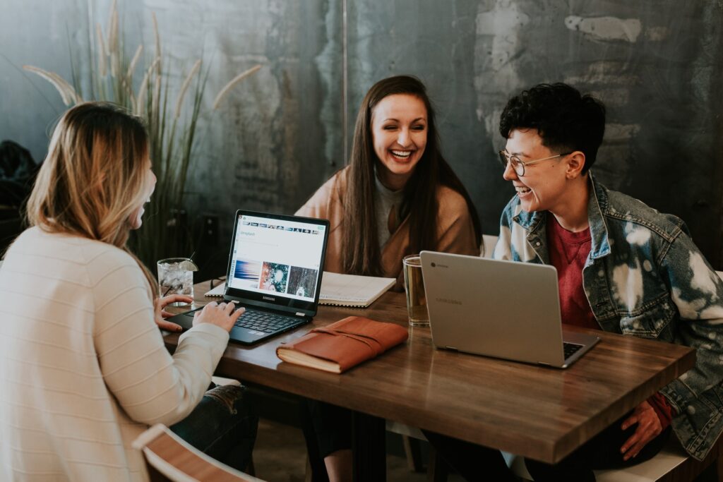 a team of colleagues laughing at some weird and wacky would you rather questions