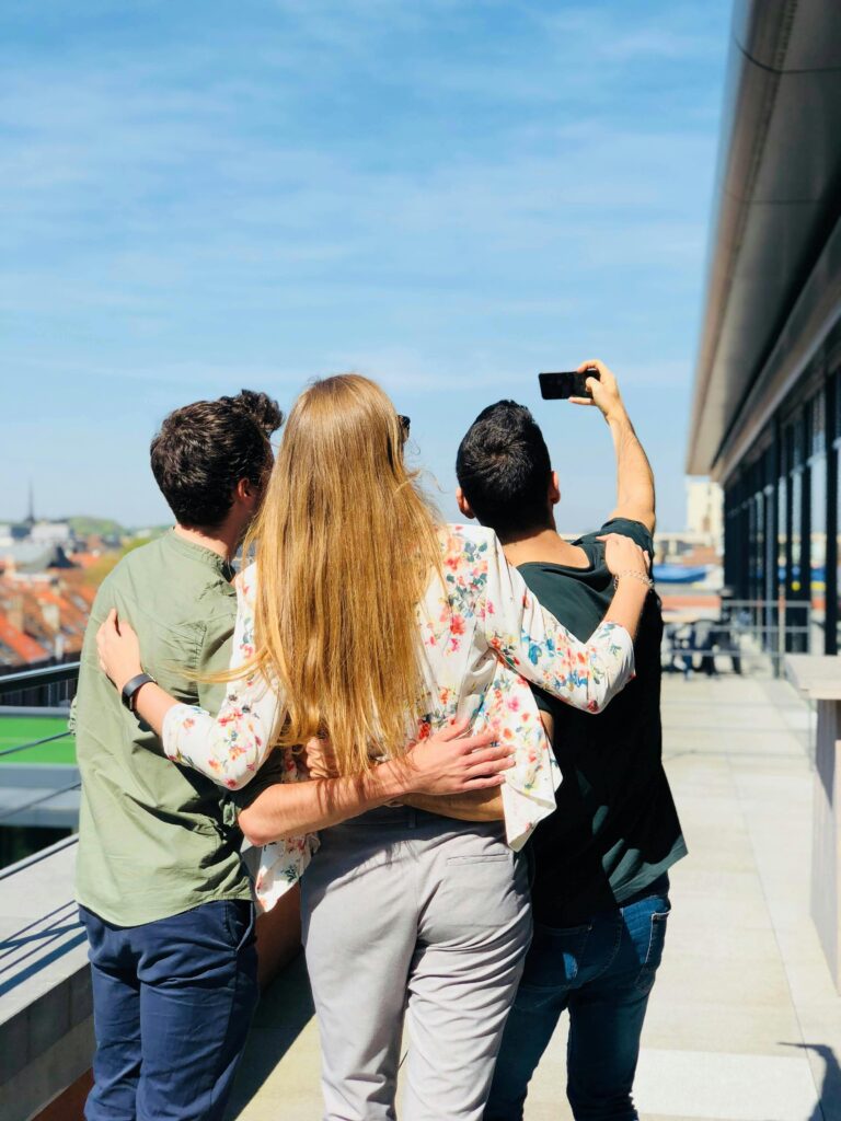 Coworkers taking a selfie during a team building activity