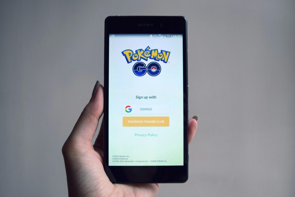 Person holding their phone using the Pokemon Go app.