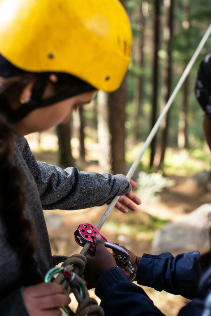 Woman doing a rope course during team building activity