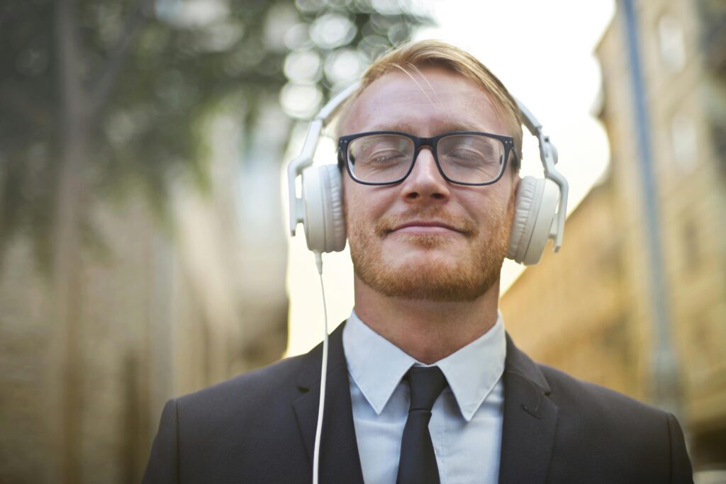 business man relaxing with headphones on