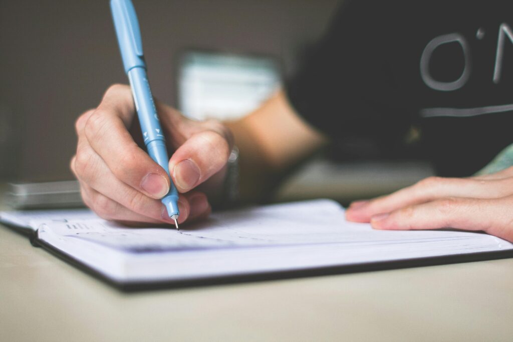 Person writing in their journal
