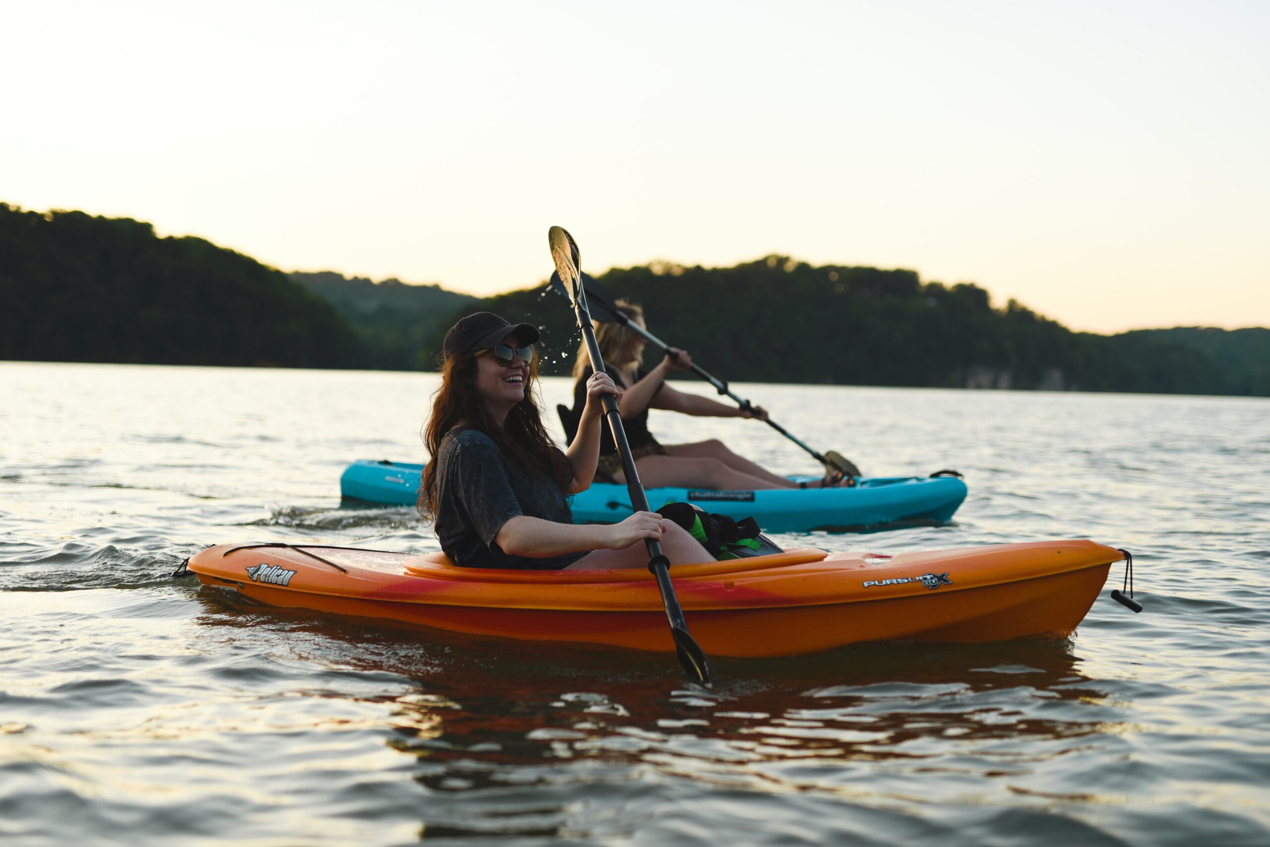 work teams kayaking together outdoors