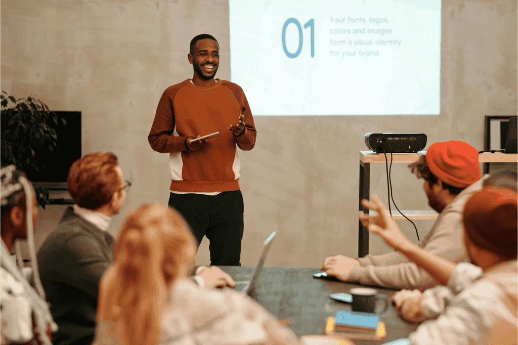 Man giving an engaging presentation in a modern work space