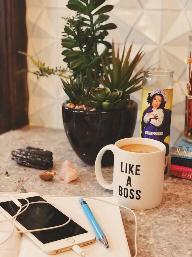 Stylish desk setup with a “Like a Boss” coffee mug