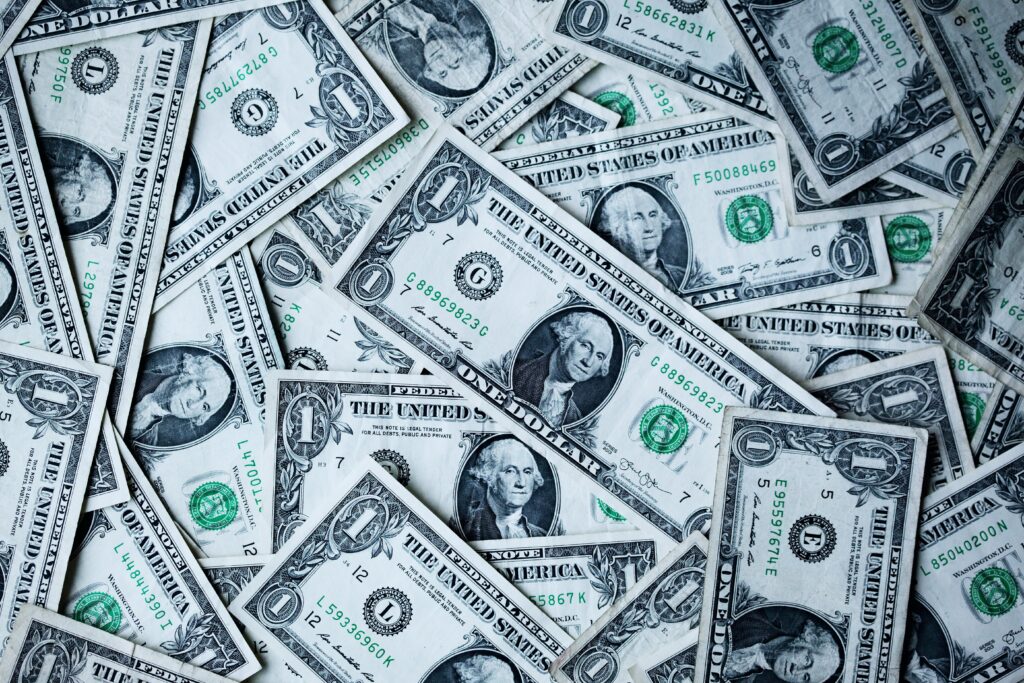a pile of money indicating monetary employee benefits 