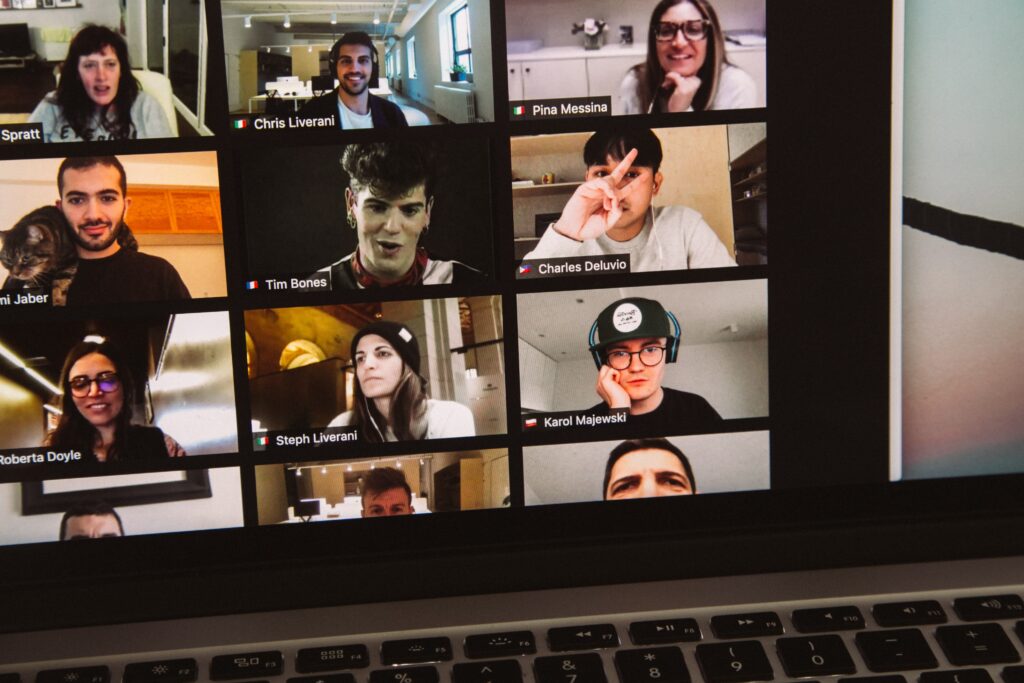 A group of colleagues playing virtual happy hour games at work 