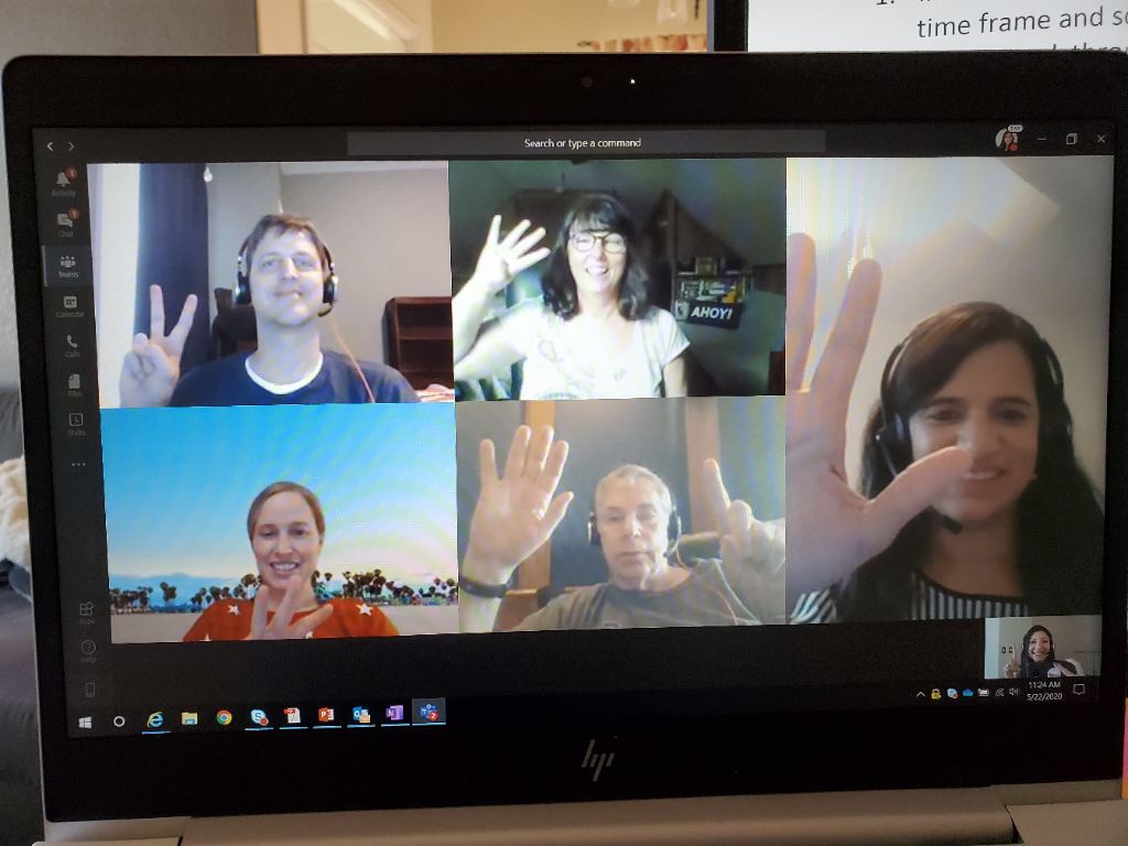 Some colleagues doing a virtual happy hour game