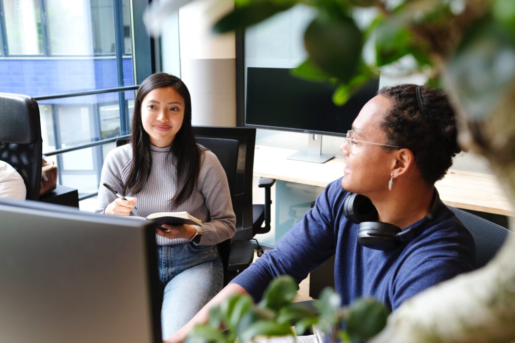 a manager and their team member collaborating 