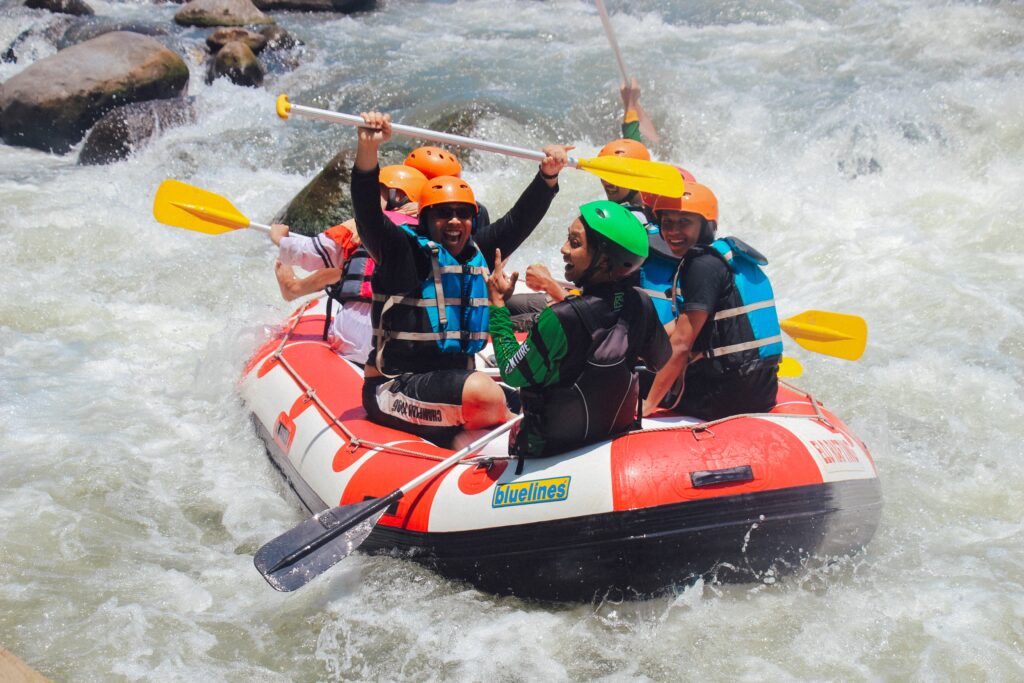 colleagues rafting for summer team building 