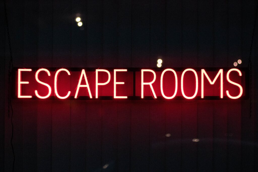image of neon lights saying "escape room" for free virtual escape room section header