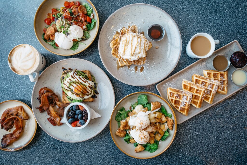 a wide variety of food laid out on a table