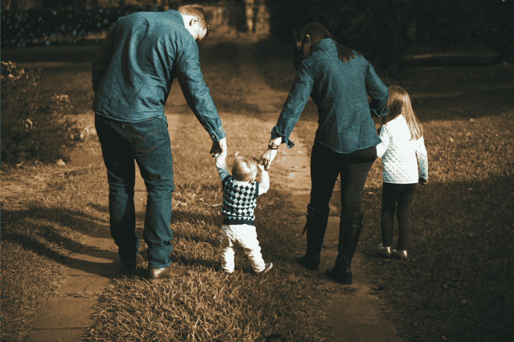 A family enjoys time together outdoors, symbolizing the importance of family benefits in employee packages.