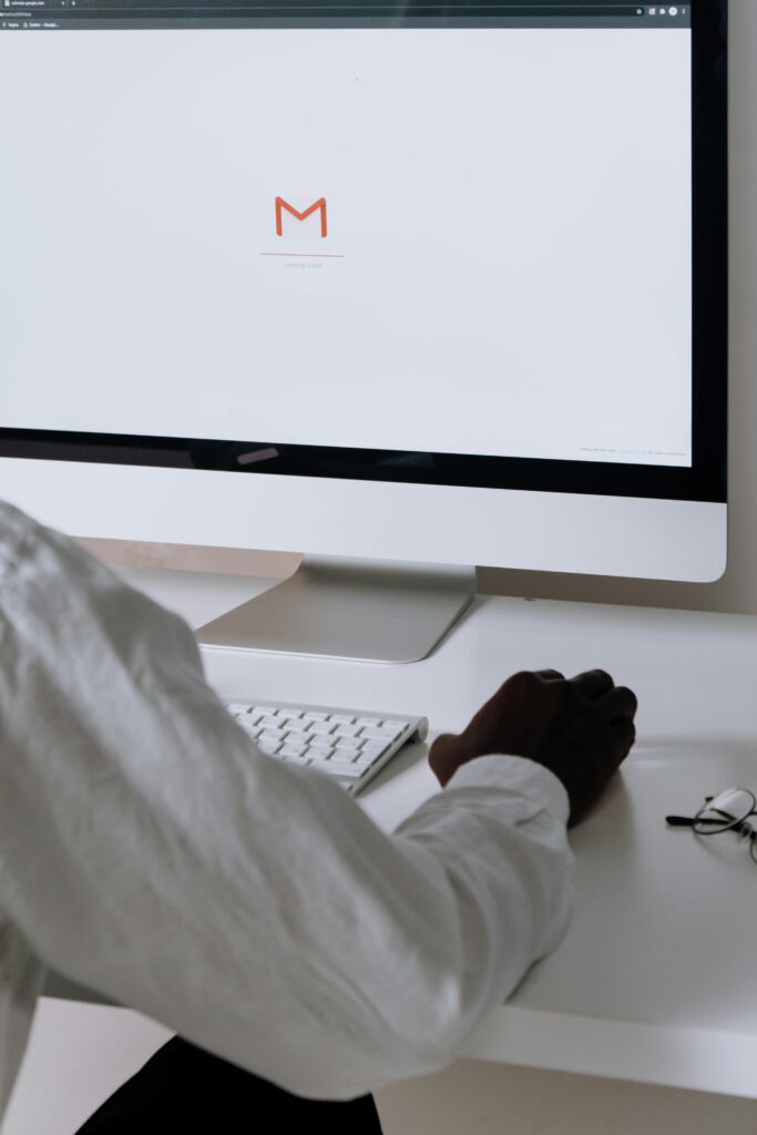 Person checking Gmail on a desktop computer – digital communication, email management, and online productivity concept.
