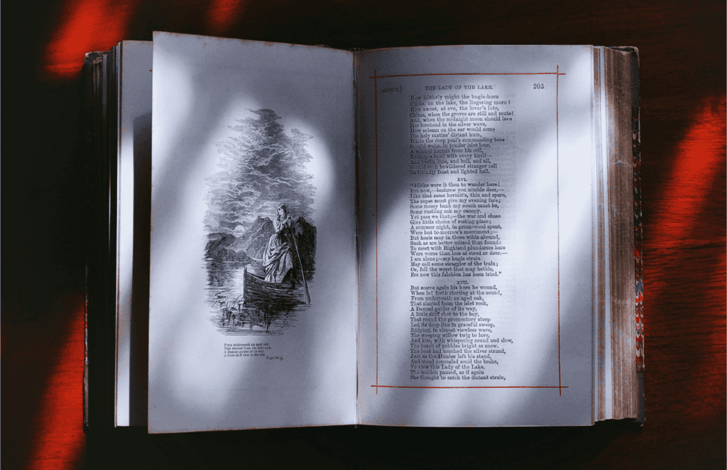 An open vintage book displays an illustration of a woman in a boat alongside a poem titled *The Lady of the Lake*.