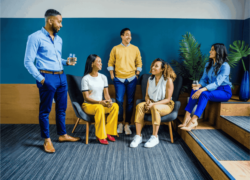 A group of coworkers relax and connect during a casual team-building break.