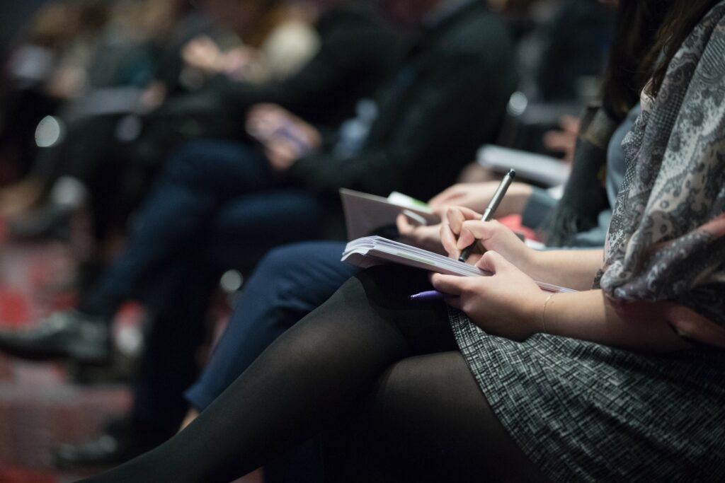 employees sitting at an in person team building event together