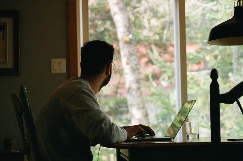 an employee working remotely at home with flexible work arrangements