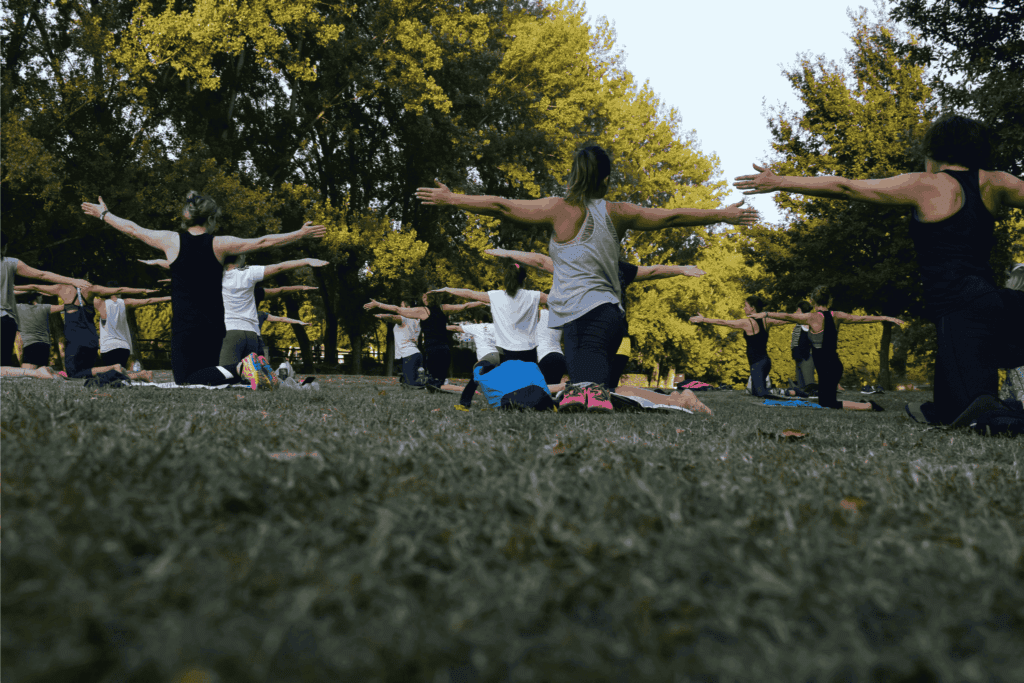 A group fitness class hosted in an outdoor park