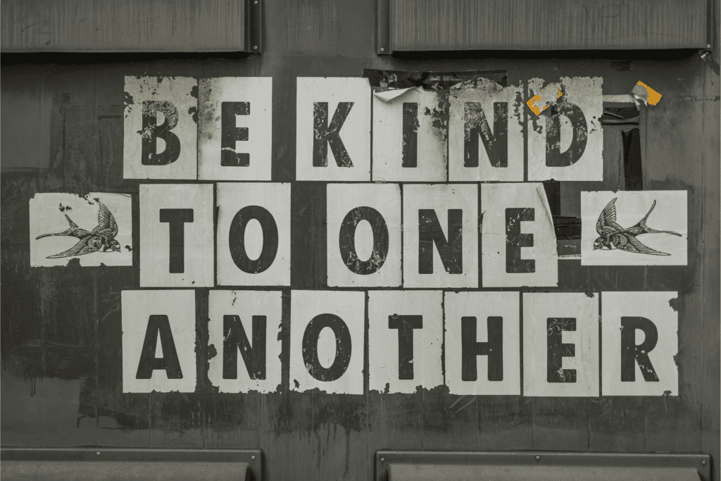 Be kind to one another motivational wall sign promoting compassion and respect.