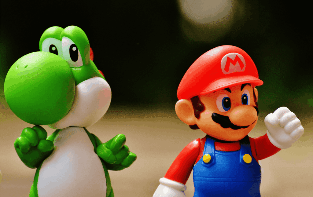 Close-up of Mario and Yoshi figurines, perfect for showcasing gaming culture and nostalgia in a fun workspace