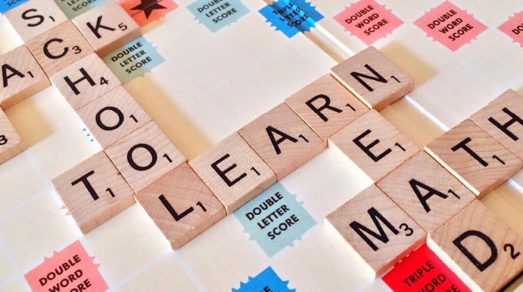 Scrabble tiles spelling School, Learn, and Math, symbolizing fun and engaging learning