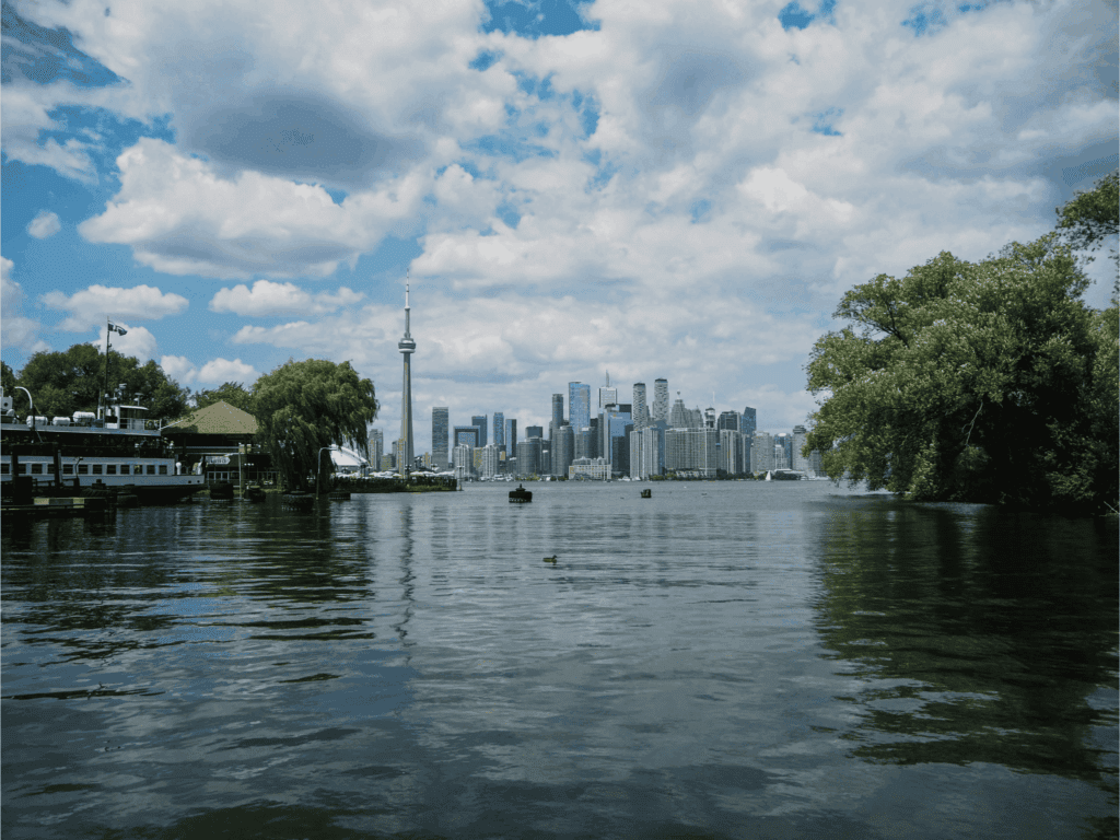 Toronto skyline with the CN Tower, viewed across the water on a partly cloudy day