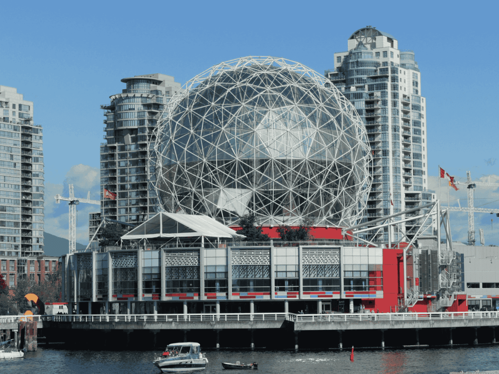 Science World geodesic dome and waterfront in Vancouver with modern high-rise buildings in the background