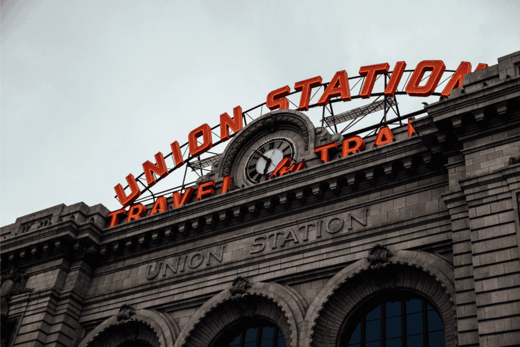 Union Station Denver with iconic neon sign and historic architecture in LoDo district.