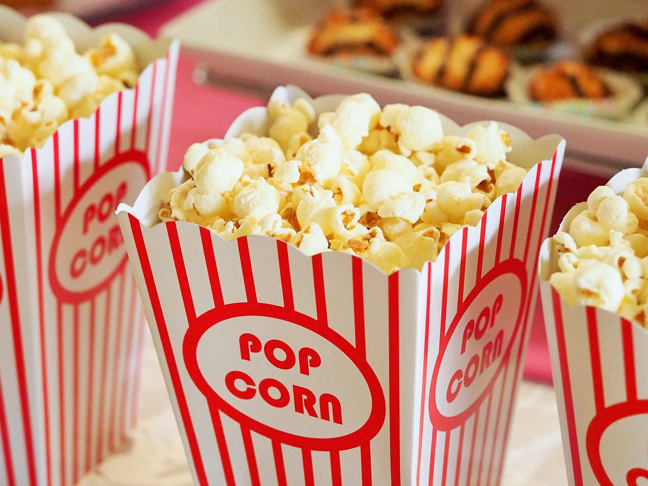 Close up image of a row of popcorn bags from the movie theater