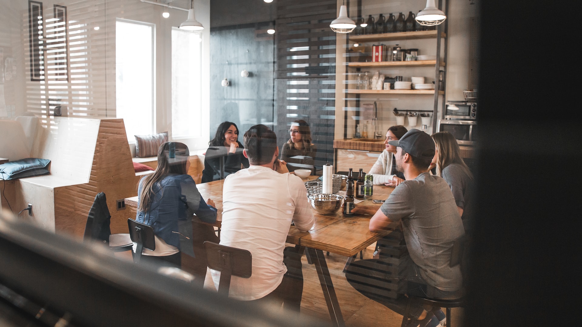 A team meeting at a long table in an off-site venue